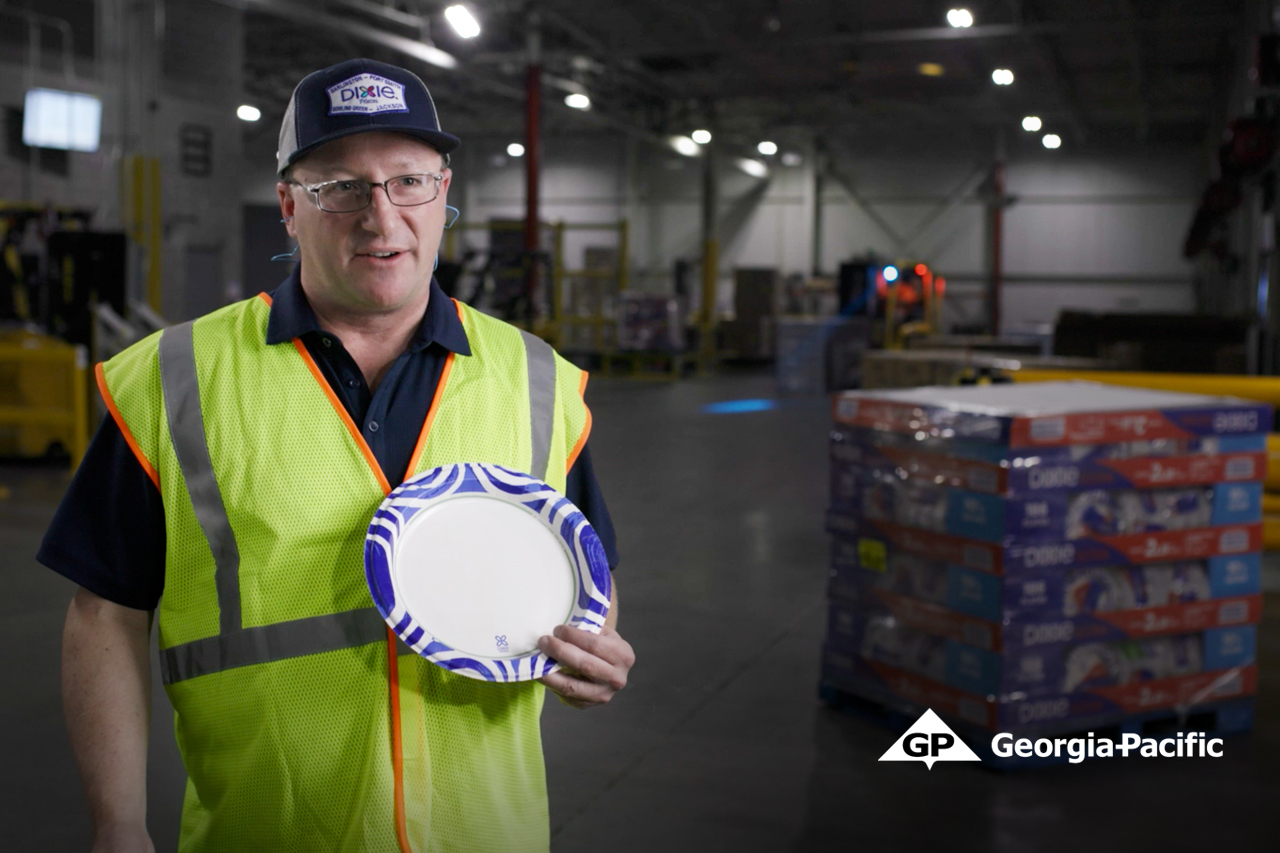 Georgia-Pacific worker standing with Dixie paper plate