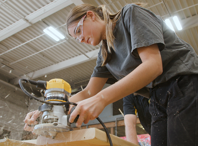 A person working in a woodshop